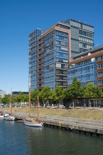 Modern office building and sailing boats at Germaniahafen, museum harbour, Kiel, Kiel Fjord, Baltic