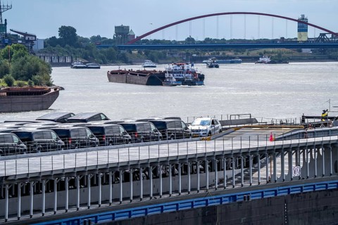 Cargo ships on the Rhine, in the background the Rhine bridge near Duisburg-Rheinhausen, Bridge of