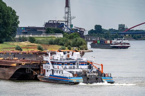 Cargo ships on the Rhine, in the background the Rhine bridge near Duisburg-Rheinhausen, Bridge of