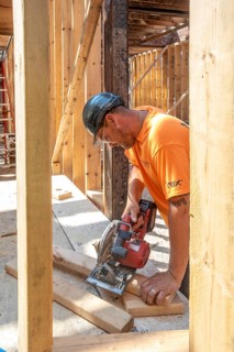 Detroit, Michigan - Jay Newcomb III helps rehab a long-vacant and crumbling commercial building in