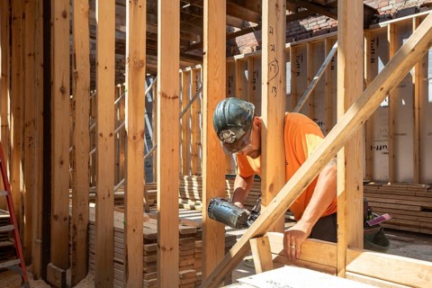 Detroit, Michigan - Jay Newcomb III helps rehab a long-vacant and crumbling commercial building in