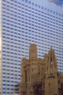 Historic St Thomas Episcopa Church, built in 1824, in front of a skyscraper, 53rd Street,