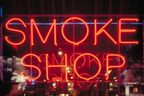 Illuminated advertising at a tobacco shop, Manhattan, New York City, USA