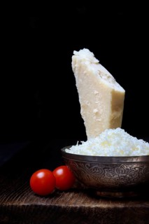 Parmesan cheese, grated cheese in rind and piece of Parmesan, Italy