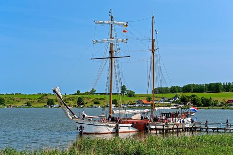 Sailing schooner Weisse DÃ¼ne at the jetty in the Achterwasser, Neppermin, Usedom Island,