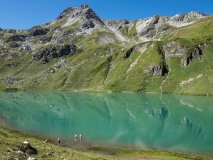 HIker at lake Engeratsgundsee, mountain range between Oberstdorf and Bad Hindelang, Allgaeu,