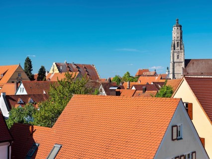 View from the medieval town wall over the houses of the historic old town to the tower of St