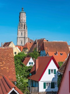 View from the medieval town wall over the houses of the historic old town to the tower of St