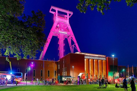 People in front of the German Mining Museum for the Extra Shift at night, Bochum, Ruhr Area, North