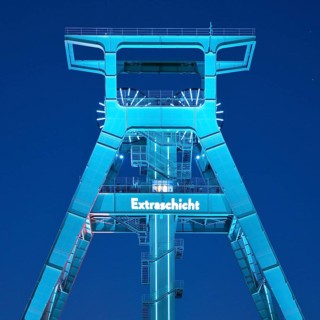 Illuminated headframe of the German Mining Museum at Extraschicht, Bochum, Ruhr area, North
