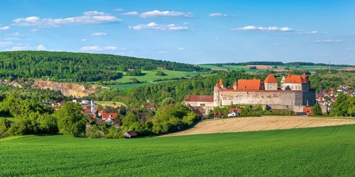 View over a green field to Harburg Castle, Donau-Ries, Swabia, Bavaria, Germany