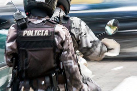 Policemen riding a motorcycle, Motion blur, City of Quito. Pichincha province, Ecuador, South
