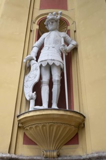 Sculpture of the giant Haymon, founder of the monastery, at the entrance portal of Wilten Abbey,