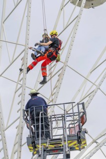 Fire brigade rescues person on Ferris wheel by abseiling, Fire brigade exercise for gondola rescue,