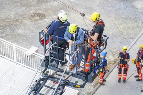 Teams during rescue exercise on platform at height, fire brigade exercise for gondola rescue,