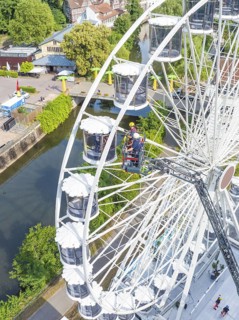 Aerial view of Ferris wheel and emergency services, fire brigade exercise for gondola rescue,