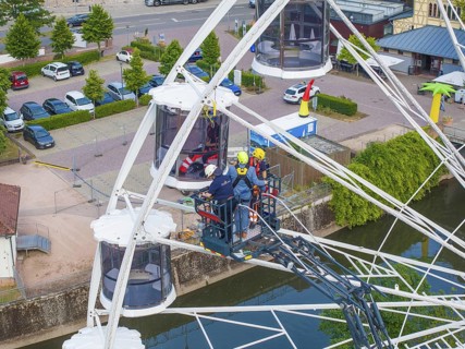 Fire brigade uses platform for rescue on Ferris wheel, Fire brigade exercise for gondola rescue,