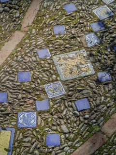 Street paving made of pebbles and tiles background, texture, Andalusia, Spain
