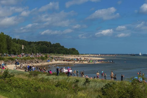 Onlookers of the windjammer parade 2025 on the Kiel Fjord at the end of the Kieler Woche, sailors,