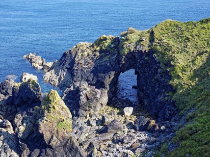 Rocky coast and rock gate on the south-east coast near the southern tip of Cornwall on the English