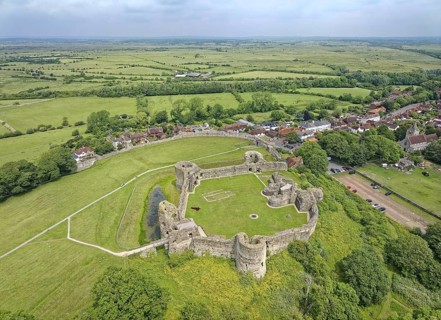 Pevensey Castle, a Norman castle. Aerial view, the village of Pevensey and the surrounding meadows