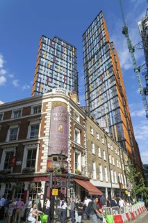 Tower block apartments of One Crown Place rise high above older properties, Sun Street, City of