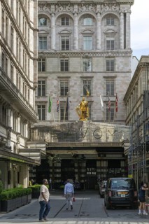 Count Peter of Savoy golden figure above entrance to The Savoy hotel, Strand, central London,