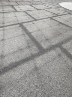 Roof construction casts shadows on the ground, Olympic Park, Munich, Bavaria, Germany