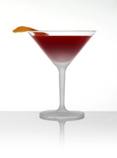 Cocktail in a cocktail glass with orange zest as garnish in front of a white background, studio