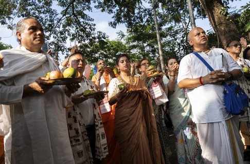 Hindu devotees offer prayers as they takes part in Rath Yatra religious procession Guwahati, India