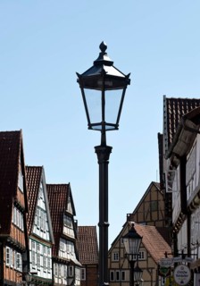 Street with half-timbered houses and historic street lamp in the old town centre, Celle, Lower