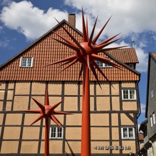 Artwork by Otto Piene entitled Fireworks for Celle in front of a half-timbered house in the