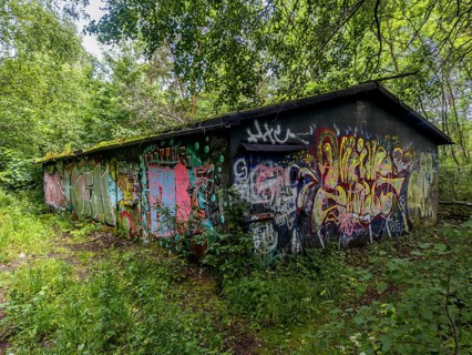 Abandoned military building in the forest, full of graffiti, in Ystad, SkÃ¥ne County, Sweden,