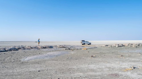Vast white empty landscape on a salt pan, tourist and off-road vehicle, Kubu Island (Lekubu), Sowa
