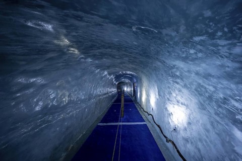 Artificial ice cave through the glacier ice, Mer de Glace, Montenvers, Chamonix, Haute-Savoie,