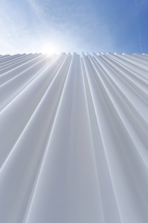 Modern white faÃ§ade made of corrugated acrylic glass, Plexiglas, SANAA production hall, architect