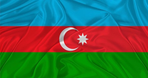 Flag of Azerbaijan with cloth texture. Close up of Azerbaijani flag waving