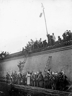 Boxer Rebellion, China, protests on a wall during the Boxer War. Chinese people gather on a wall
