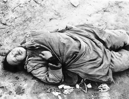 Chinese woman in Brenan Road, Shanghai. Shot for looting. The Second Sino-Japanese War began on 7
