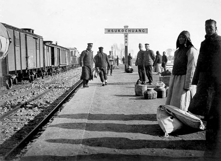 People waiting on the railway platform in Hsukochuang, China around 1900 Photograph around 1900