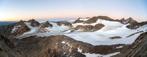 Mountain panorama, picturesque high mountain landscape at sunrise, glacier and rocky mountain