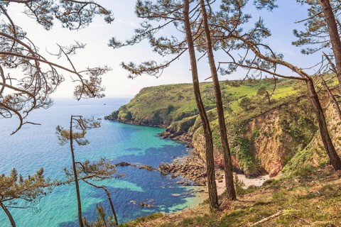 Rocky coastline with a scenics sea view from the coast with steep cliffs by the sea in the summer,