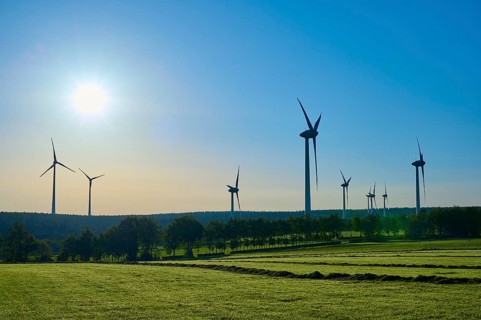 Wind turbines adorn a landscape with sunny skies and green fields, summer, Rohren, Monschau, Eifel,