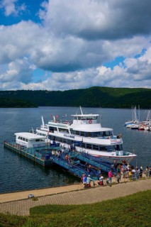 Passenger ship Stella Maris, with tourists at the landing stage, at the harbour, cloudy sky,