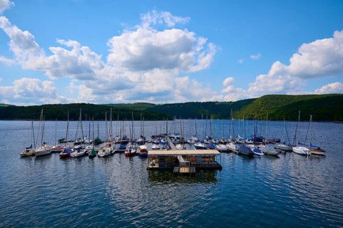 Sailing boats at a jetty, with partly cloudy sky, summer, Rursee, Rurtalsperre, Heimbach,