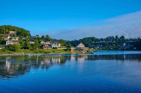 Idyllic lake with houses on the shore, clear blue sky on a sunny summer day, summer, Rursee,