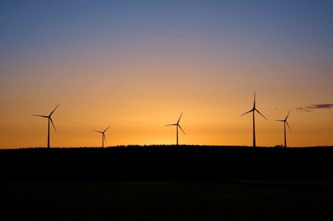 Wind turbines in front of an orange-coloured sunrise, Rohren, Monschau, Eifel, North