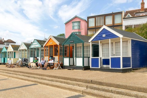 Seaside beach huts on the seafront at Southwold, Suffolk, England, UK