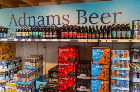 Adnams beer products on display inside brewery shop, Southwold, Suffolk, England, UK