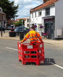 British Telecom technicians working on fibre optic Broadband in street, Southwold, Suffolk,
